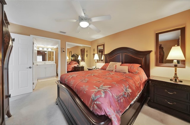 bedroom featuring ensuite bathroom and ceiling fan