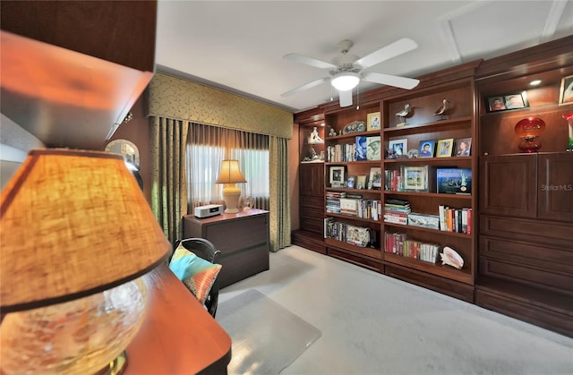 office area featuring ceiling fan and crown molding