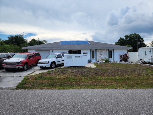 view of front of house with solar panels