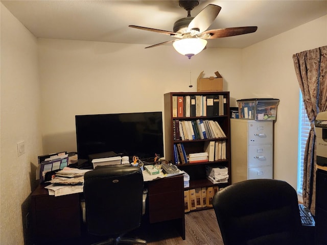 office area with ceiling fan and dark hardwood / wood-style flooring