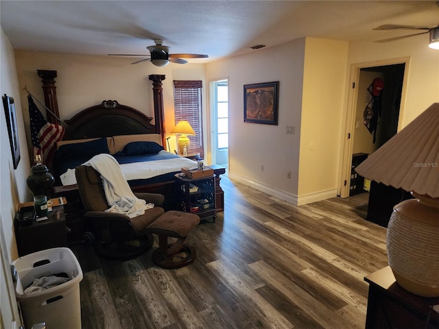 bedroom with ceiling fan and hardwood / wood-style flooring