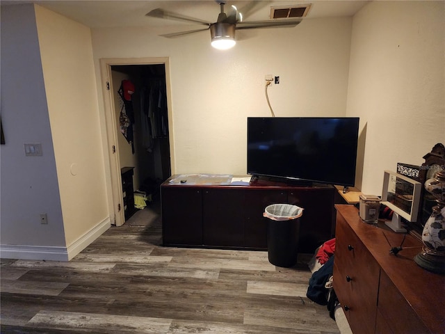 office area with ceiling fan and hardwood / wood-style floors