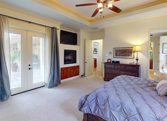 carpeted bedroom featuring access to exterior, french doors, ceiling fan, and crown molding