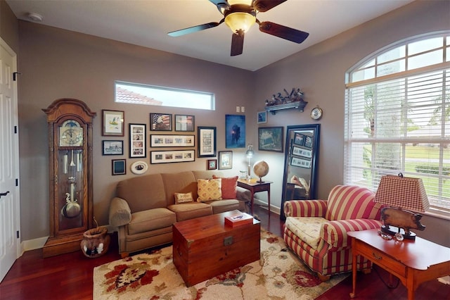 living room with hardwood / wood-style flooring, ceiling fan, and a wealth of natural light