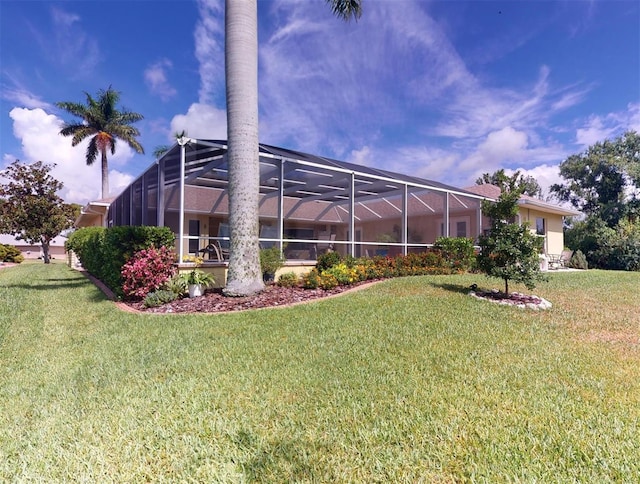 view of yard featuring glass enclosure