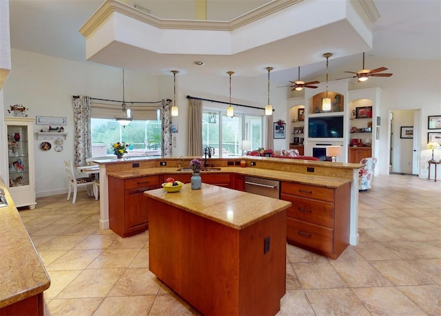 kitchen featuring a center island, hanging light fixtures, and ceiling fan