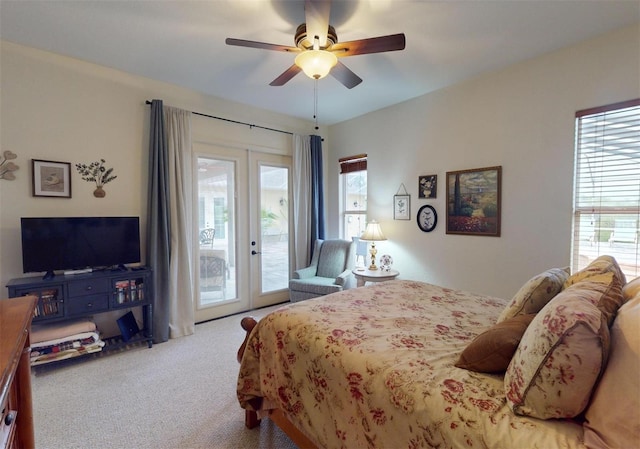 bedroom featuring carpet flooring, access to outside, multiple windows, and ceiling fan