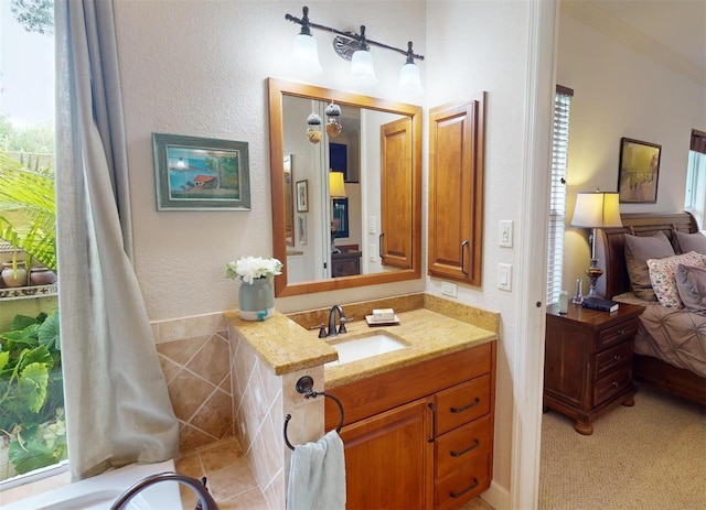 bathroom with plenty of natural light and vanity