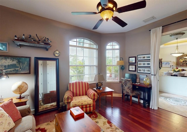 interior space with dark hardwood / wood-style floors and ceiling fan