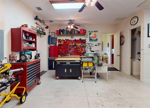 interior space with a workshop area and ceiling fan