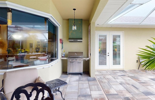 view of patio with a grill and french doors