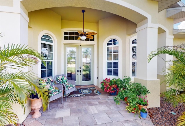 view of exterior entry featuring ceiling fan