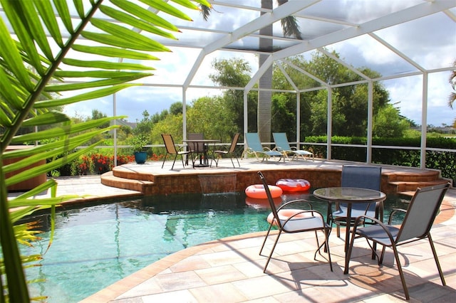 view of pool with a patio and a lanai