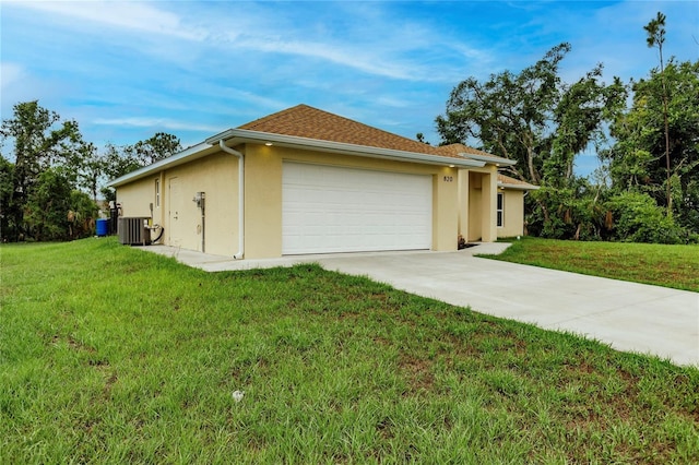 view of property exterior with central AC unit, a garage, and a yard