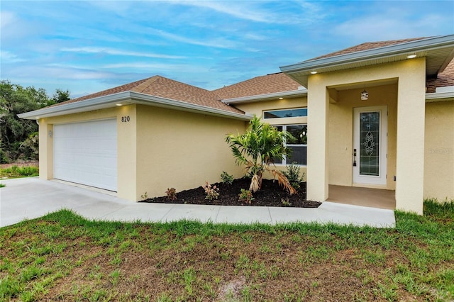 view of side of property with a garage