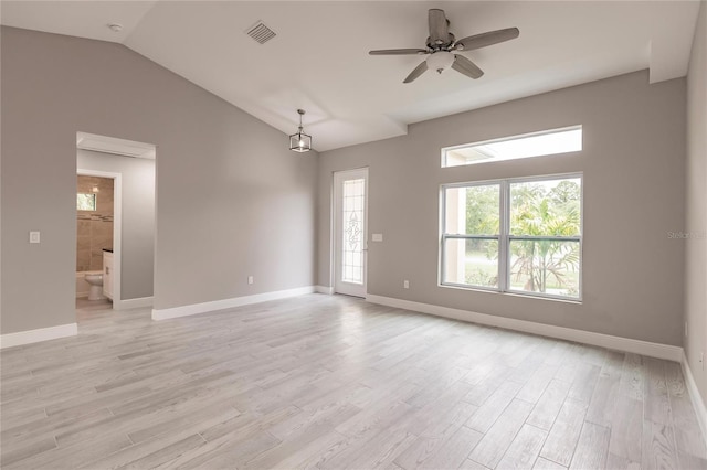 unfurnished room with ceiling fan, light hardwood / wood-style floors, a healthy amount of sunlight, and lofted ceiling