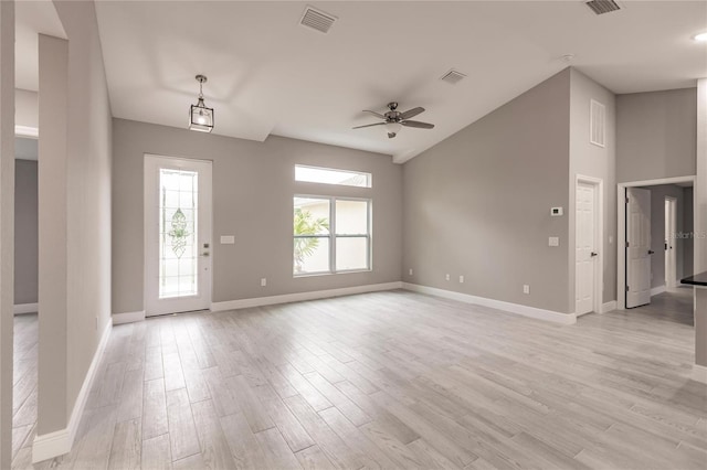 interior space featuring ceiling fan, light hardwood / wood-style flooring, and lofted ceiling