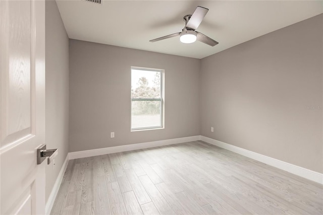 unfurnished room with light hardwood / wood-style flooring and ceiling fan