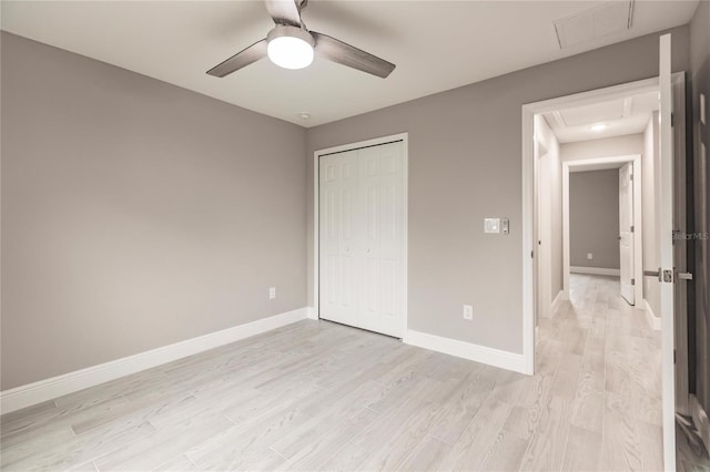 unfurnished bedroom with light wood-type flooring, a closet, and ceiling fan