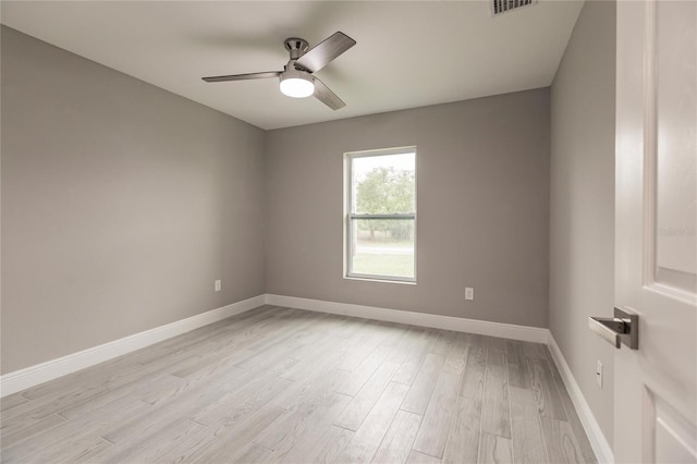 spare room featuring ceiling fan and light hardwood / wood-style floors