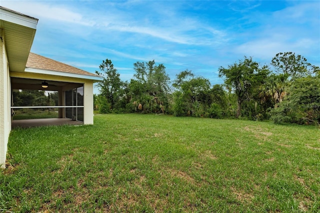 view of yard with a sunroom