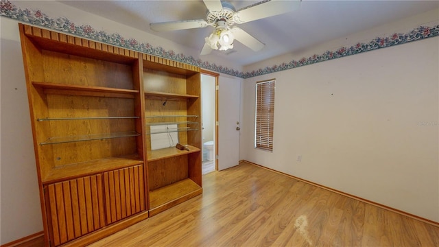 interior space with ceiling fan and light hardwood / wood-style flooring