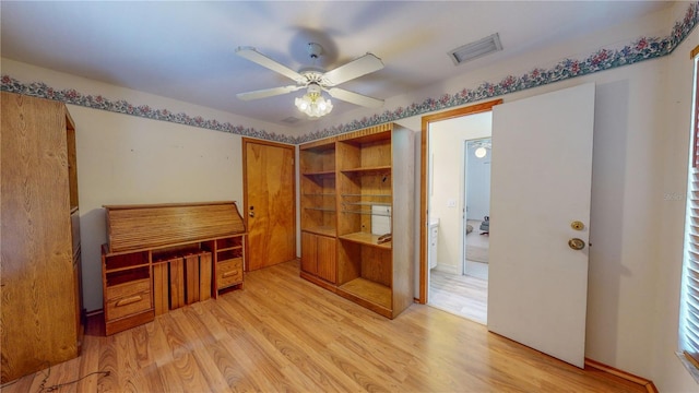 office area with light hardwood / wood-style flooring and ceiling fan