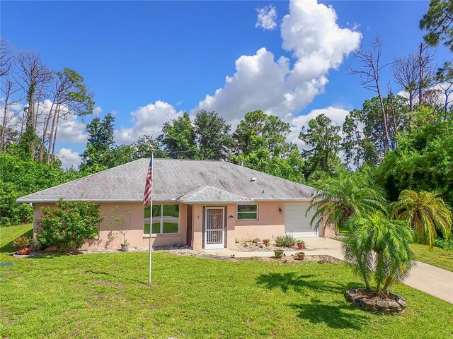 ranch-style house with a front yard and a garage