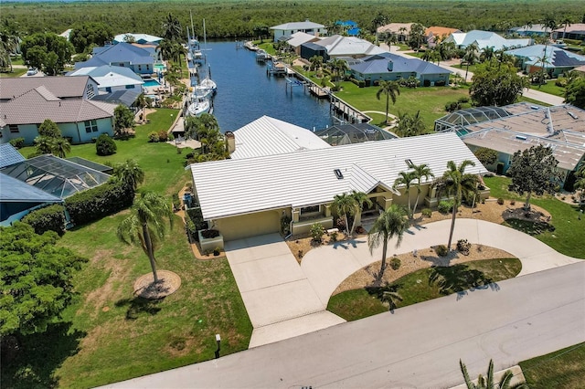 birds eye view of property with a water view