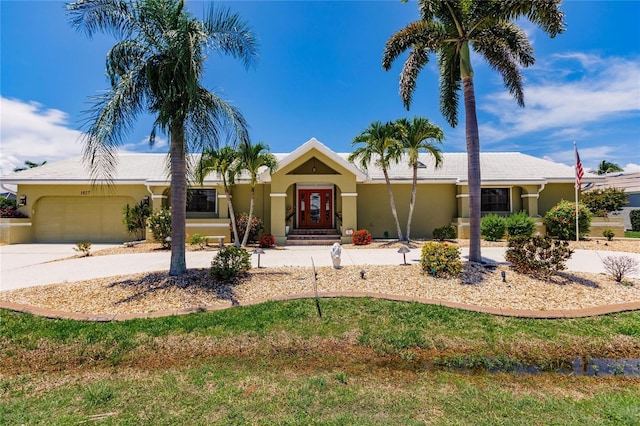 ranch-style house featuring a garage