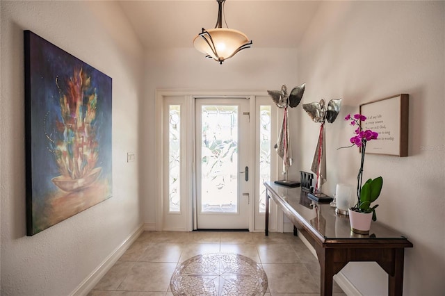 foyer featuring light tile patterned floors