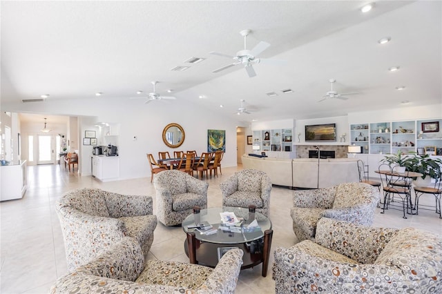 living room featuring lofted ceiling and light tile patterned floors