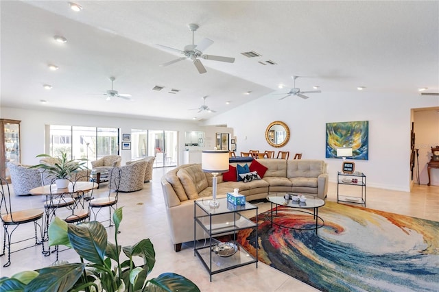 living room featuring light tile patterned floors, vaulted ceiling, and ceiling fan