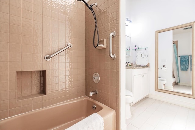 full bathroom with tiled shower / bath combo, toilet, and vanity