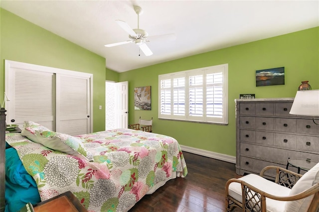 bedroom featuring a closet, ceiling fan, lofted ceiling, and dark hardwood / wood-style floors