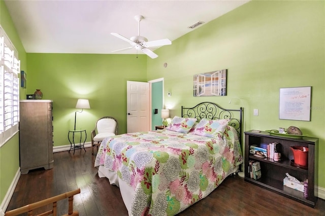 bedroom with dark hardwood / wood-style flooring, ceiling fan, and lofted ceiling