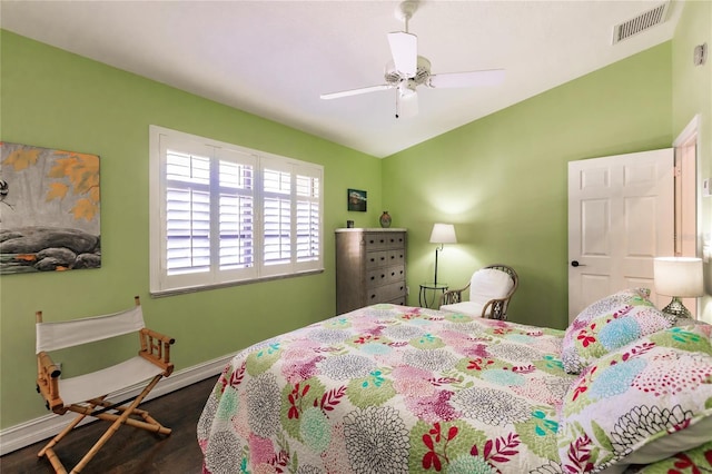 bedroom featuring dark hardwood / wood-style flooring and ceiling fan