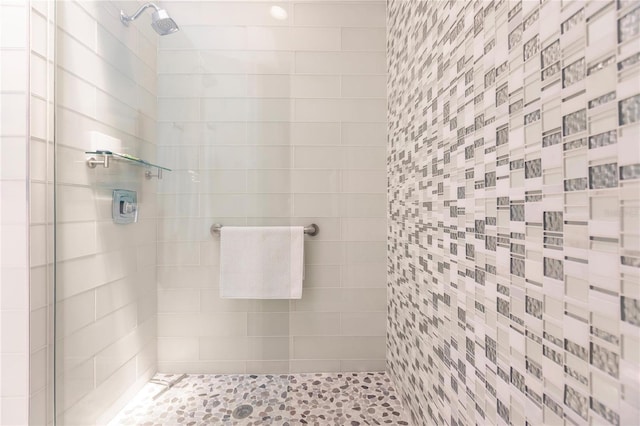 bathroom with a tile shower