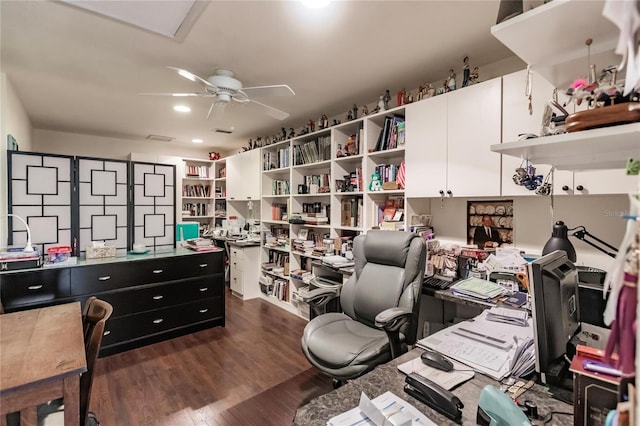 home office with dark hardwood / wood-style floors and ceiling fan