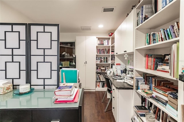 home office with dark hardwood / wood-style flooring