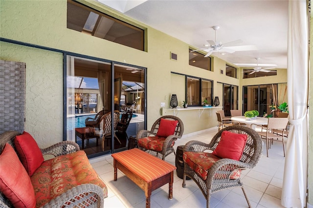 sunroom with ceiling fan and lofted ceiling with skylight