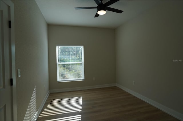 spare room featuring ceiling fan and hardwood / wood-style flooring