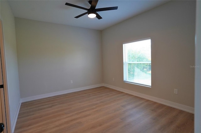 empty room featuring ceiling fan and light wood-type flooring