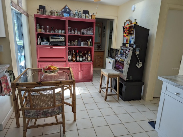 dining room featuring plenty of natural light and light tile floors