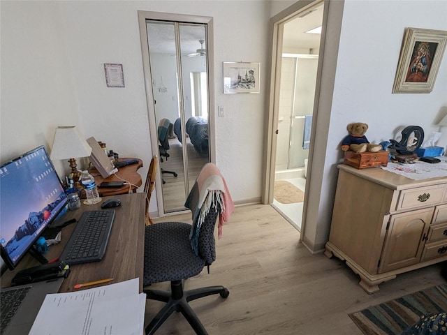 office space with ceiling fan and light hardwood / wood-style flooring