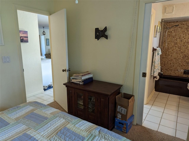 bedroom featuring light tile floors