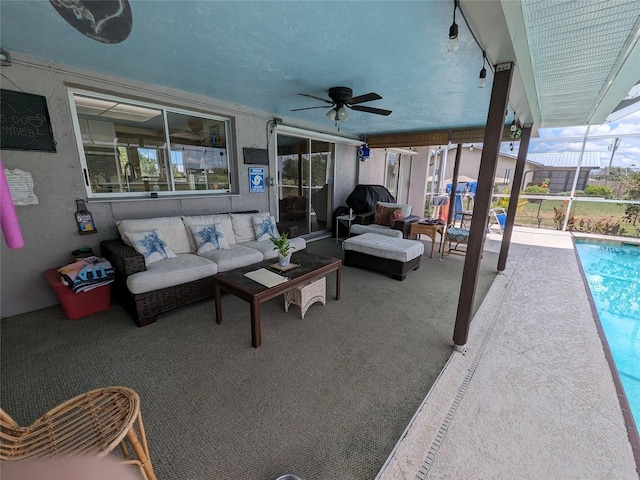 view of terrace with an outdoor living space and ceiling fan