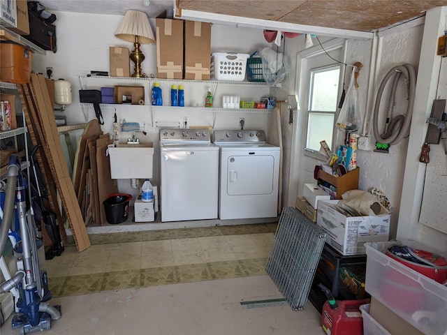 washroom with sink, washer and clothes dryer, and hookup for an electric dryer