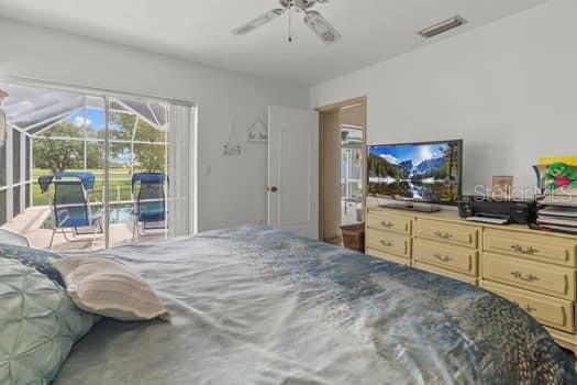 bedroom featuring ceiling fan and access to outside