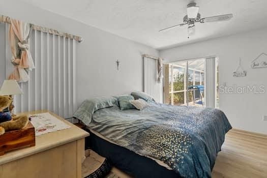 bedroom featuring hardwood / wood-style floors and ceiling fan